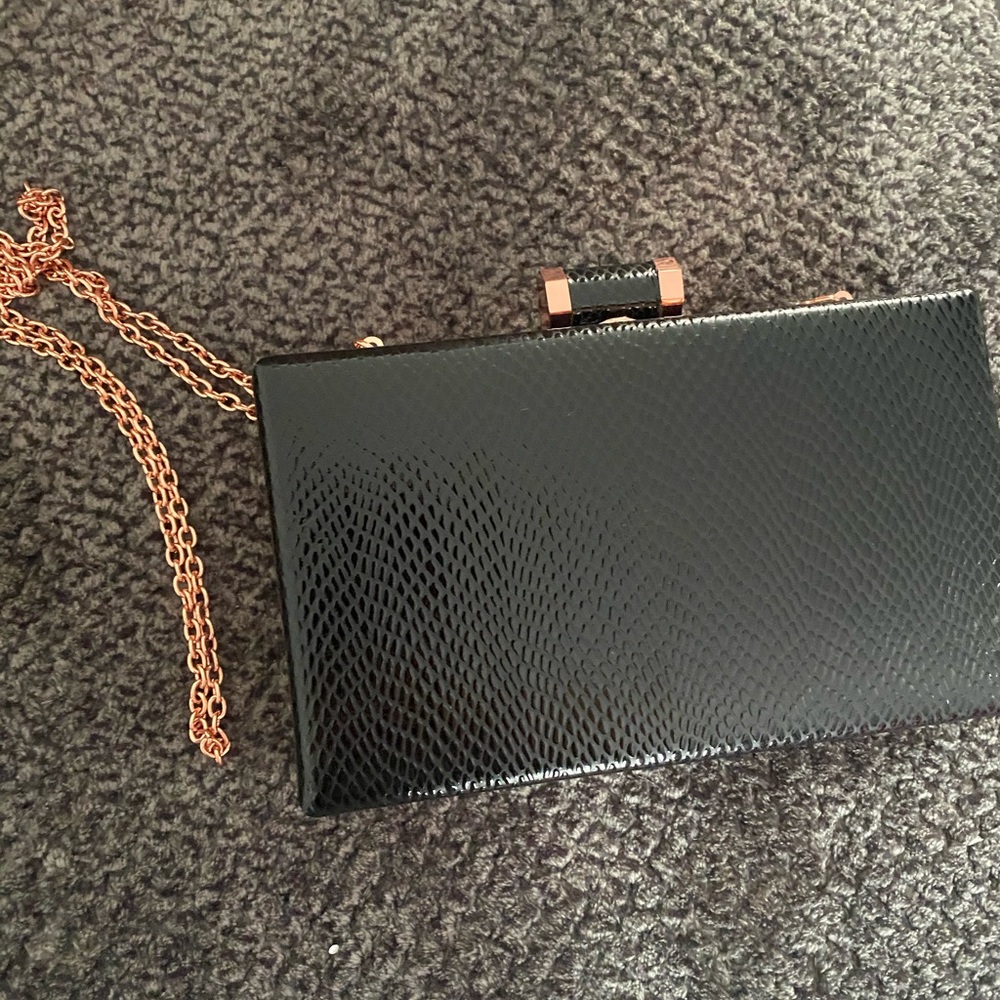 Clutch with crossbody chain. From Akira Chicago.